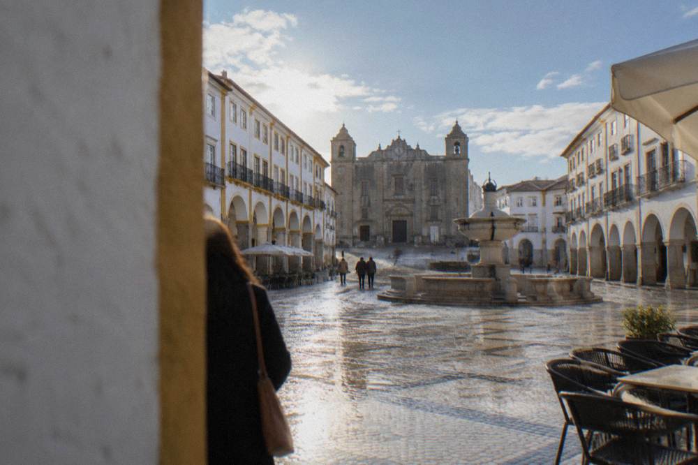 The marble-paved Praça do Giraldo in Évora with its Renaissance fountain and arcade buildings