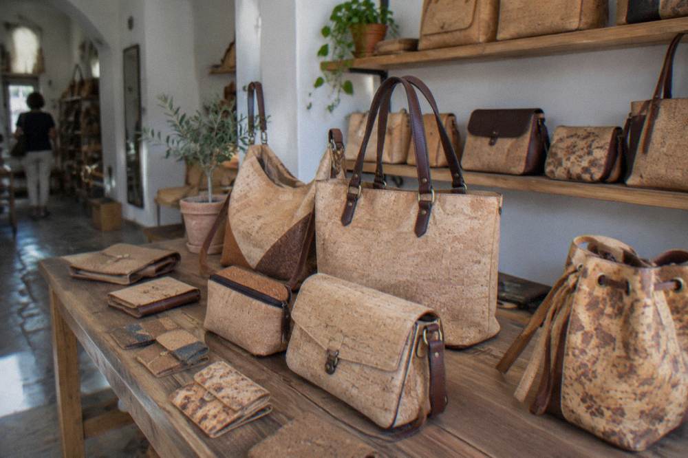 Cork handbags and accessories displayed in a shop interior in Évora's historic centre