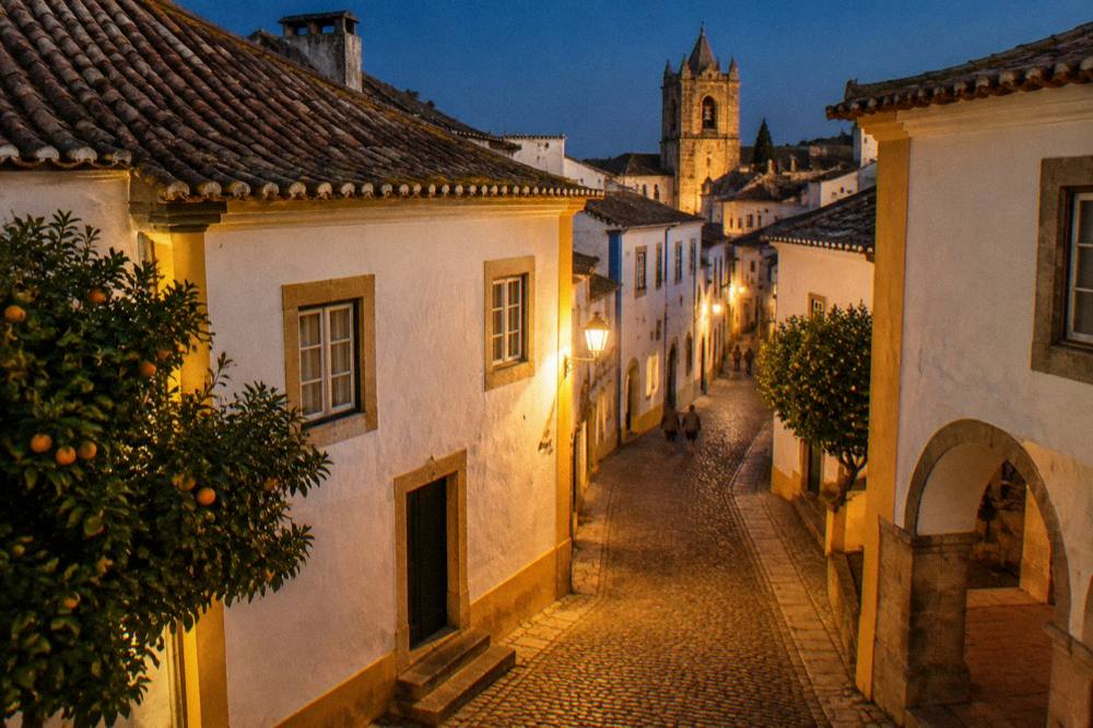Golden evening light on white walls and tiled roofs in the historic centre of Évora