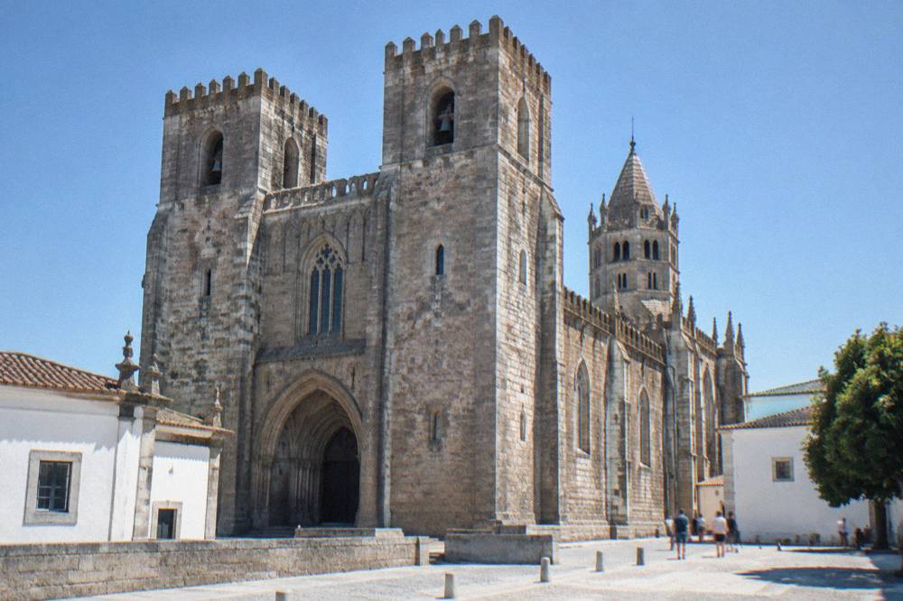The Gothic interior of the Sé de Évora cathedral seen from the nave