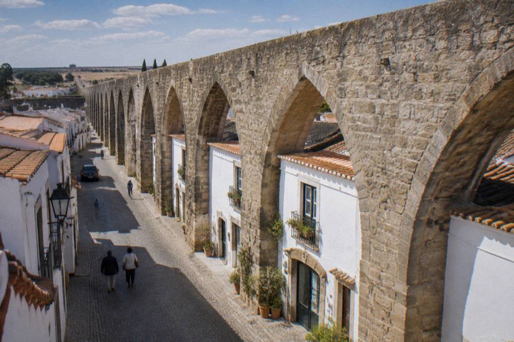 Houses built into the arches of the Água de Prata aqueduct on the Rua da Cano in Évora