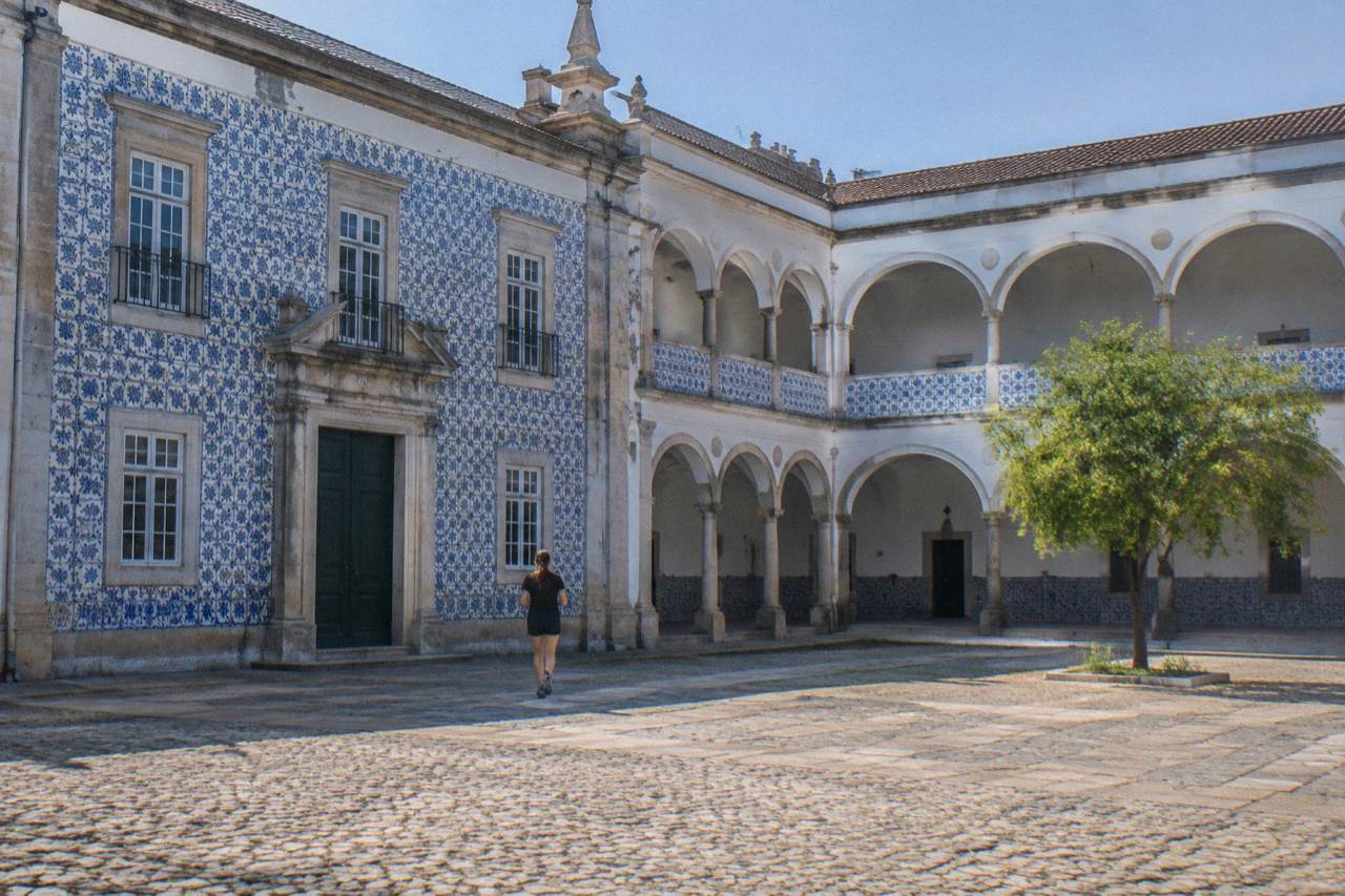 The tiled facade of the University of Évora's Colégio do Espírito Santo seen from the square in front