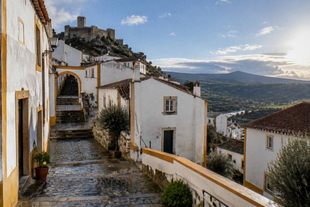 Green hills of the Serra de São Mamede under a wide sky in Portugal