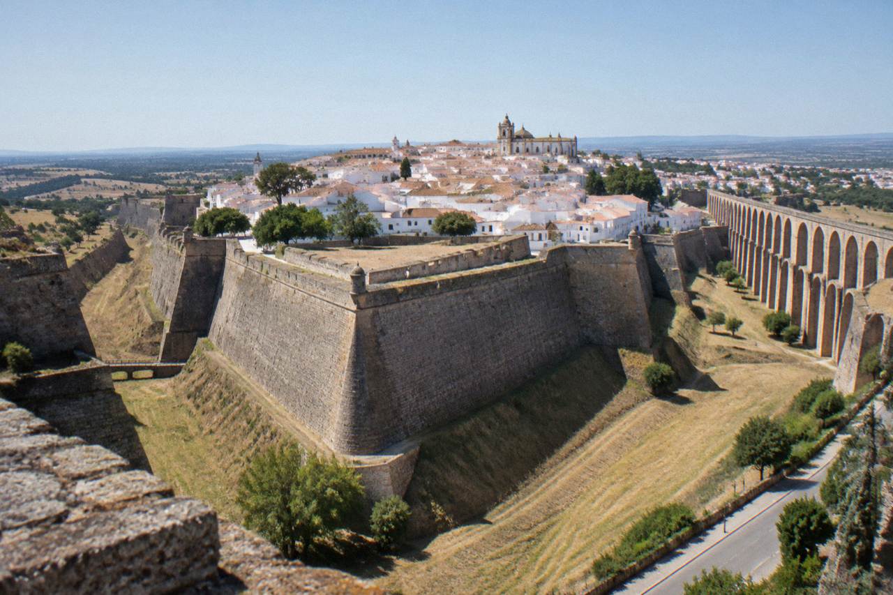 Walled hill town of Elvas rising above the Alentejo plain with old fortifications under a clear sky