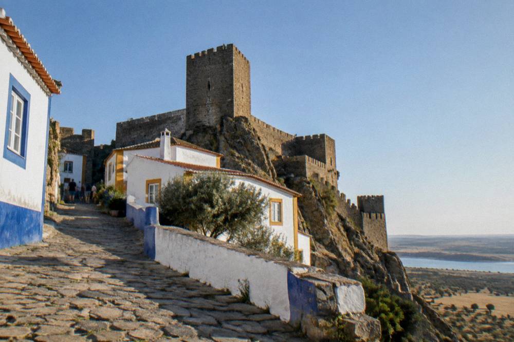 Medieval stone walls and towers of Monsaraz castle against the sky