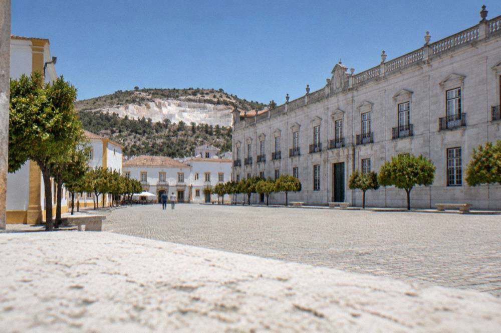 An open marble quarry in the hills near Vila Viçosa with pale cut stone terraces