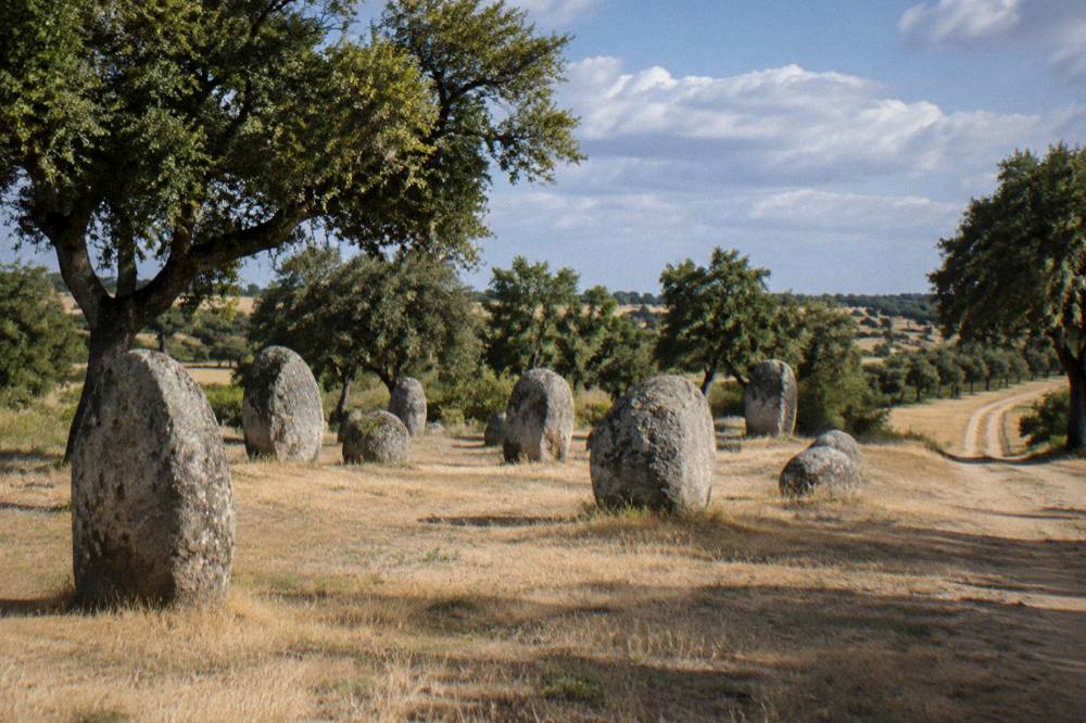 Standing stones of a prehistoric cromlech on open Alentejo grassland