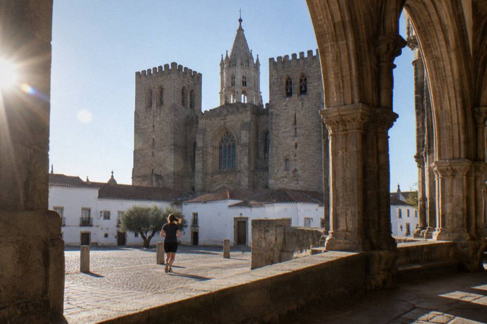 Cloister of the Évora cathedral with Gothic arches and afternoon light