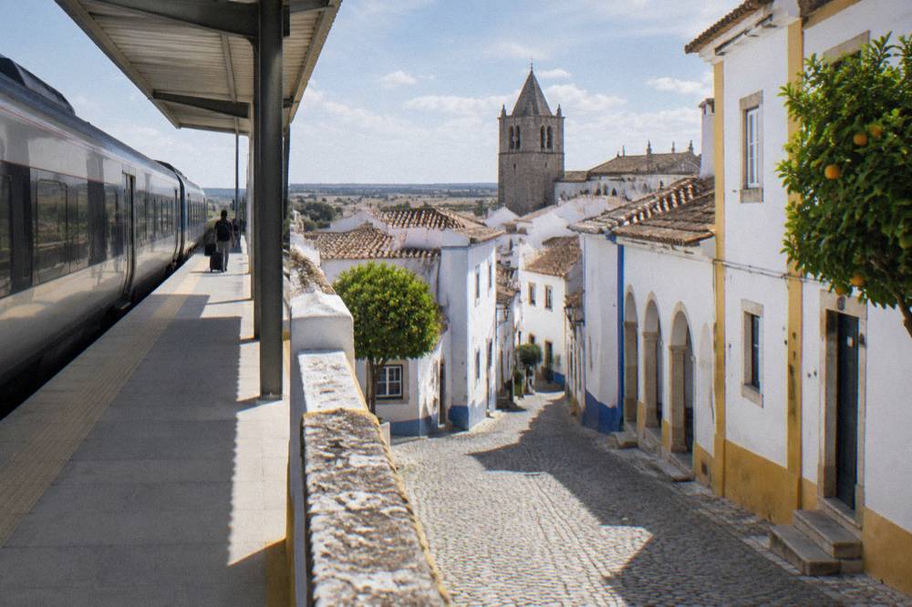An Intercidades train at a Portuguese station platform on the way to Évora