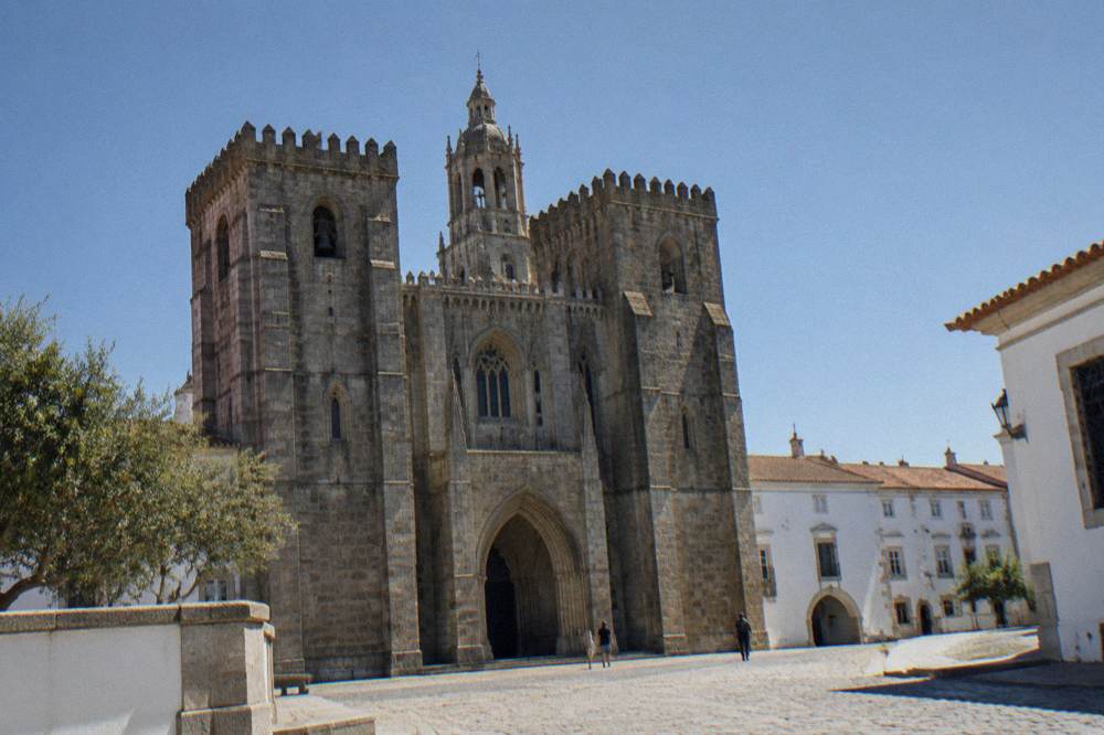 The Gothic interior of Évora cathedral with stone vaulting and soft light through high windows