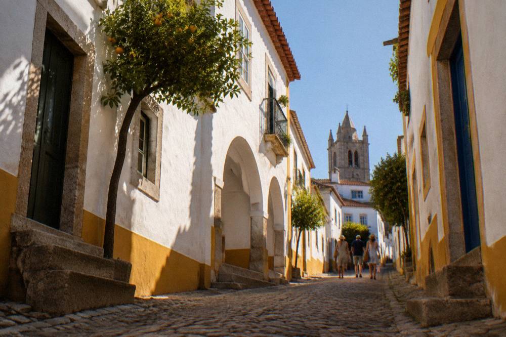 Heat shimmer over the rooftops of Évora seen from a high terrace