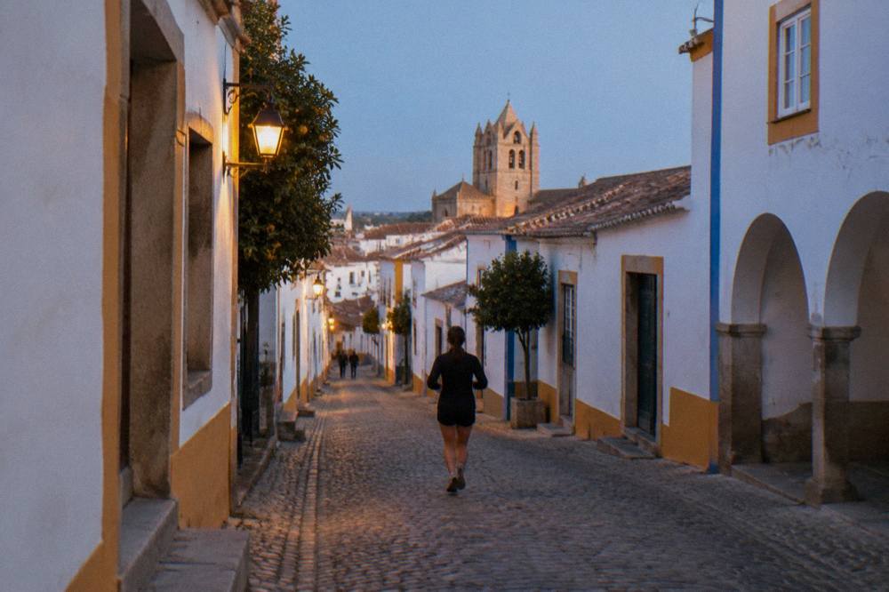 Golden evening light on Évora's rooftops and cathedral seen from a high vantage point