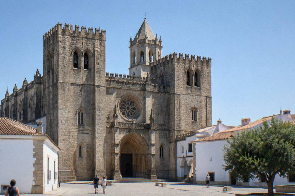 The Gothic interior of Évora cathedral with stone pillars and natural light