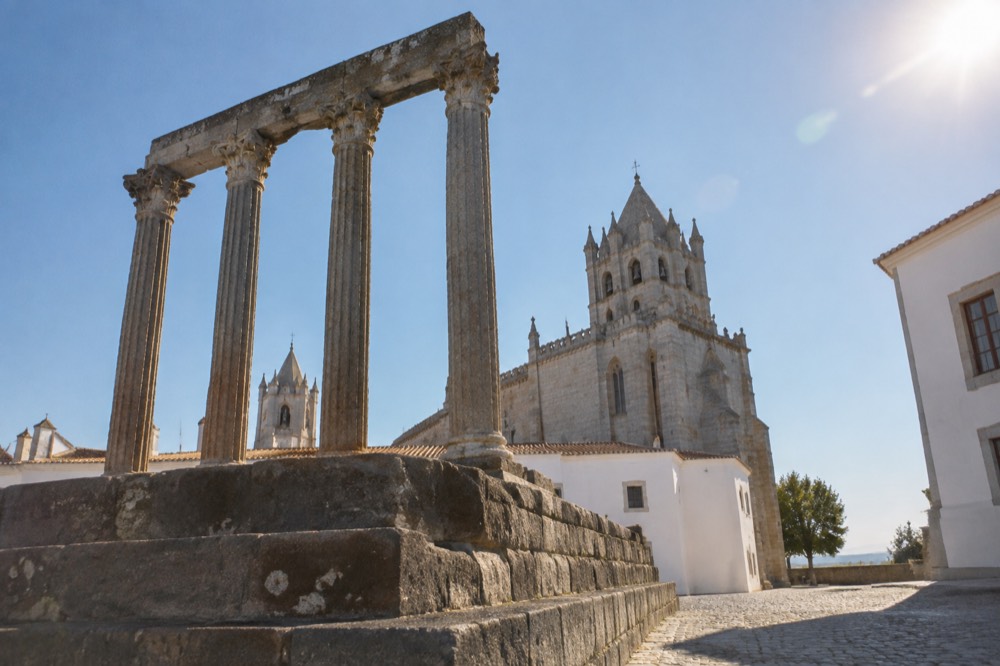 The Roman temple and cathedral towers seen above the rooftops of central Évora