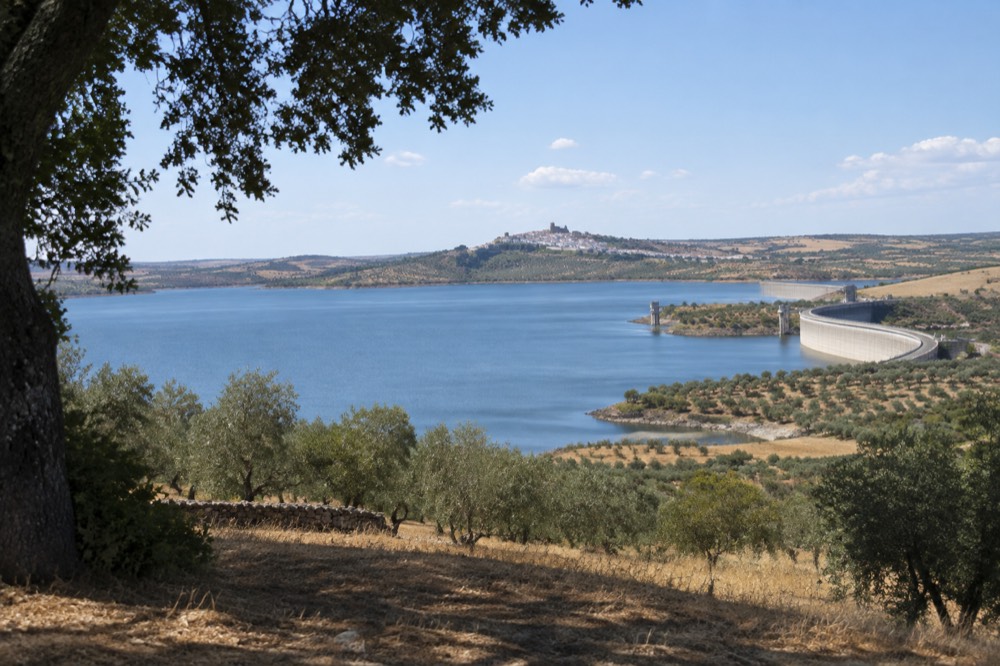 The walled village of Monsaraz above the Alqueva lake seen from a distance